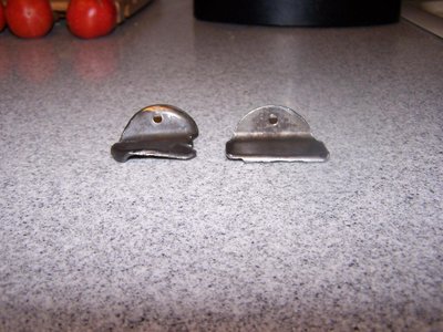 A friend of mine once found one of these pieces (I presume the one on the left) floating around in one of the intake manifolds on his ragwing 170. He found the other piece still riveted in the sump after I told him what the first piece was.