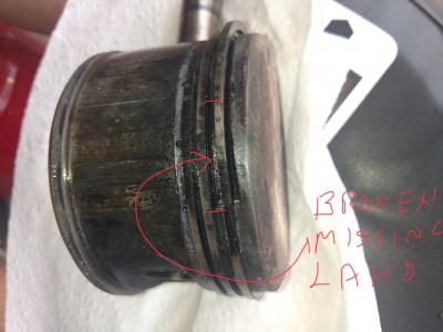 Area of missing/broken ring-land.   Notice how much the ring actually “flexed” and eating into the piston “crown”.